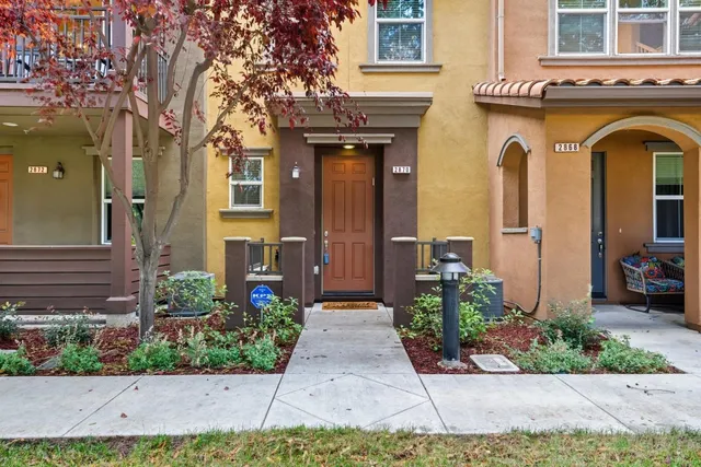 a view of kitchen cabinets refrigerator and wooden floor