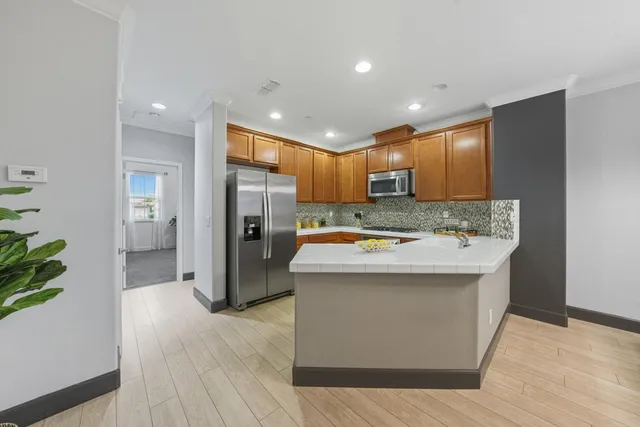 a kitchen with a refrigerator and a sink