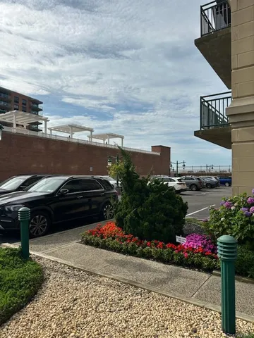a view of a terrace with chairs and potted plants