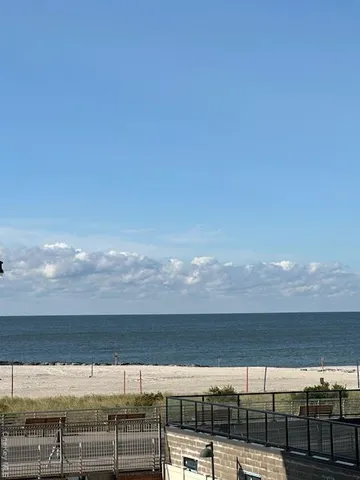 a view of swimming pool with outdoor seating