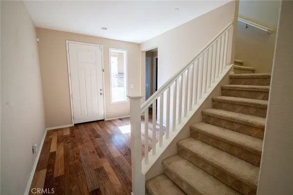 a view of entryway with wooden floor