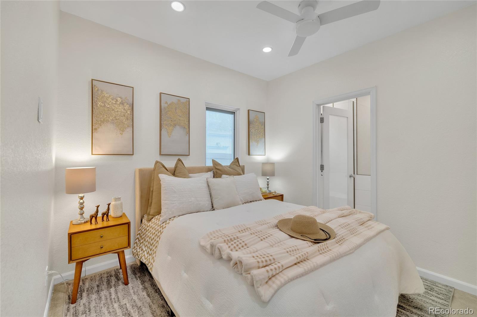 2124 Gray Street Edgewater, CO 80214 - Photo 14 of 49 a bedroom with a bed and a table in it