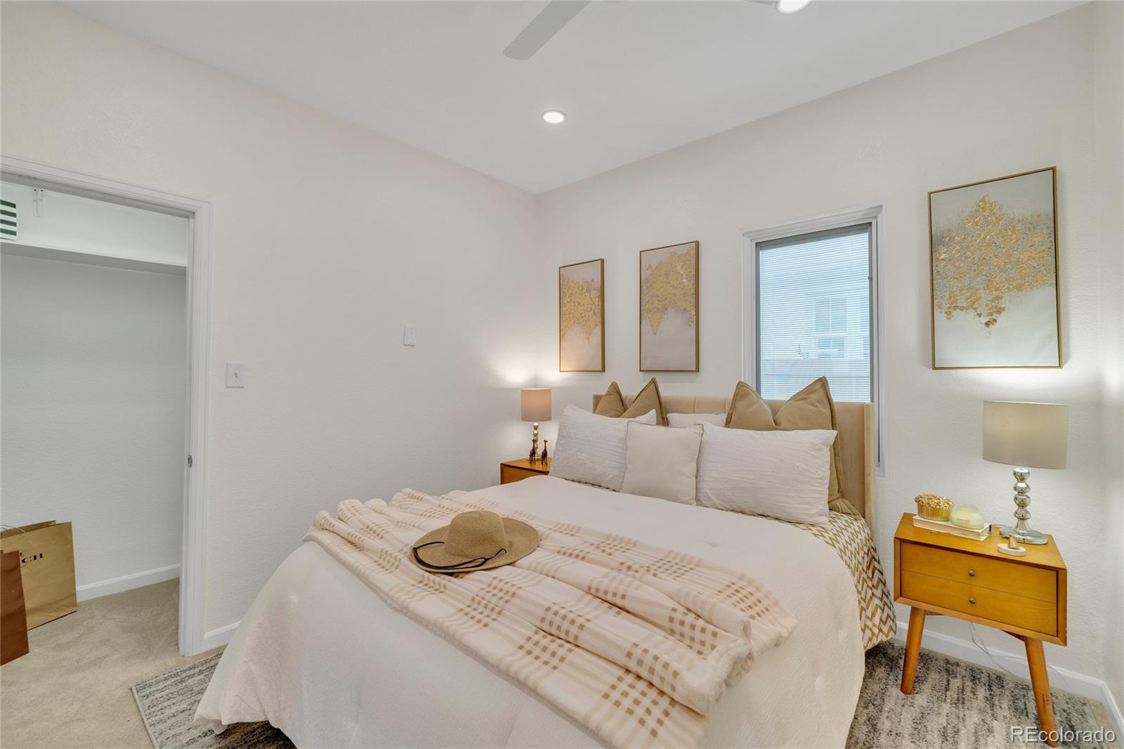 2124 Gray Street Edgewater, CO 80214 - Photo 16 of 49 a bedroom with a bed and wooden floor