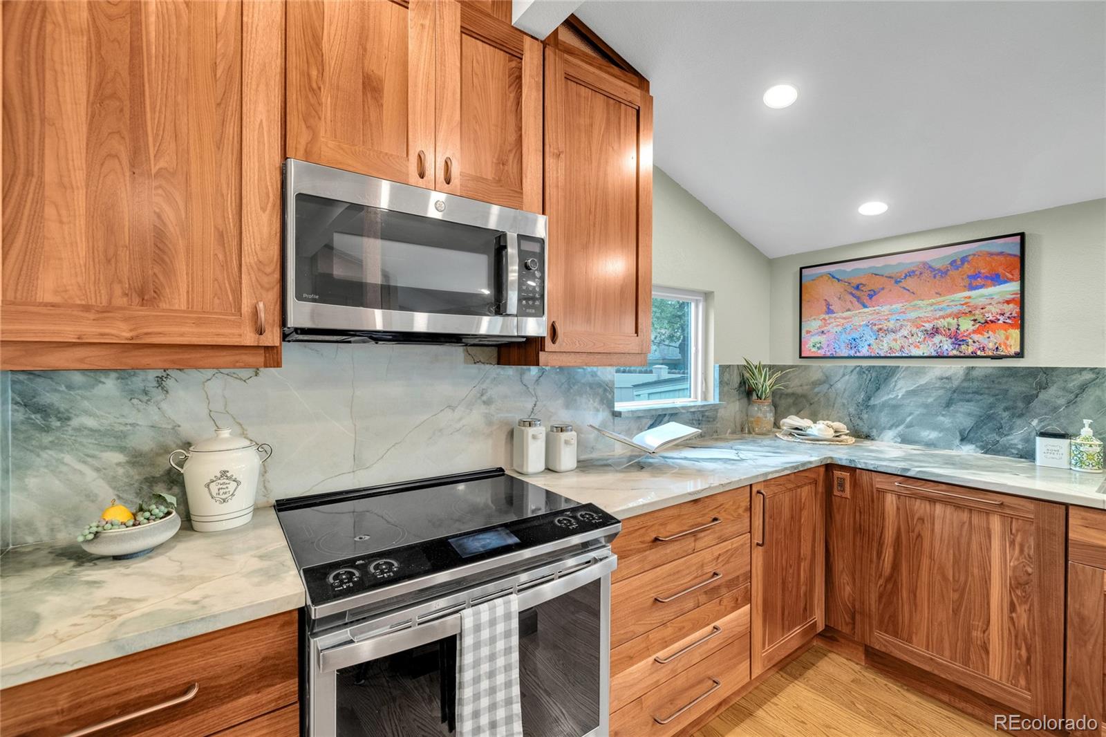 2124 Gray Street Edgewater, CO 80214 - Photo 31 of 49 a kitchen with stainless steel appliances granite countertop a stove a sink and a microwave