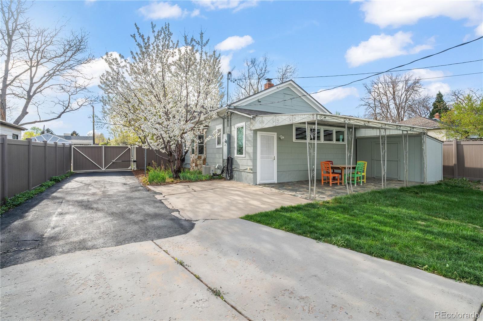 2124 Gray Street Edgewater, CO 80214 - Photo 35 of 49 a view of a house with a yard and potted plants