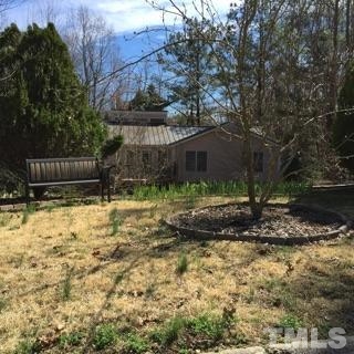 7104 Mill Ridge Road Raleigh, NC 27613 - Photo 3 of 4 a view of a backyard