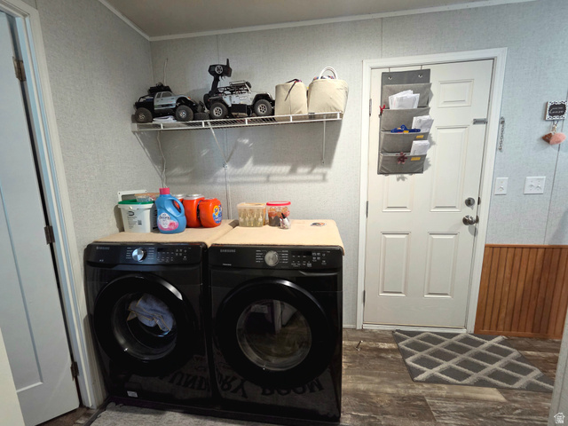 597 North State Street, Unit 67 Orem, UT 84057 - Photo 13 of 23 Laundry area featuring independent washer and dryer, dark wood-style flooring, wood walls, a wainscoted wall, and ornamental molding