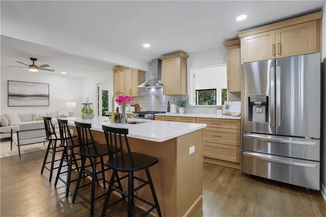 a living room with furniture and large windows