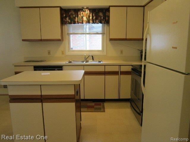 23031 Farmington Road, Unit 37 Farmington, MI 48336 - Photo 10 of 25 kitchen from laundry.JPG