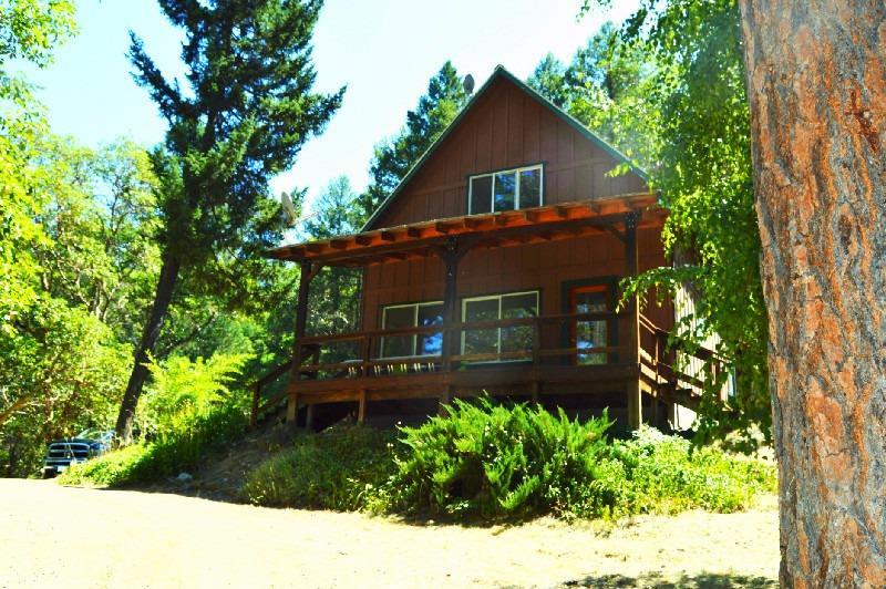 11825 Upper Applegate Road Jacksonville, OR 97530 - Photo 1 of 15 a front view of a house with a yard
