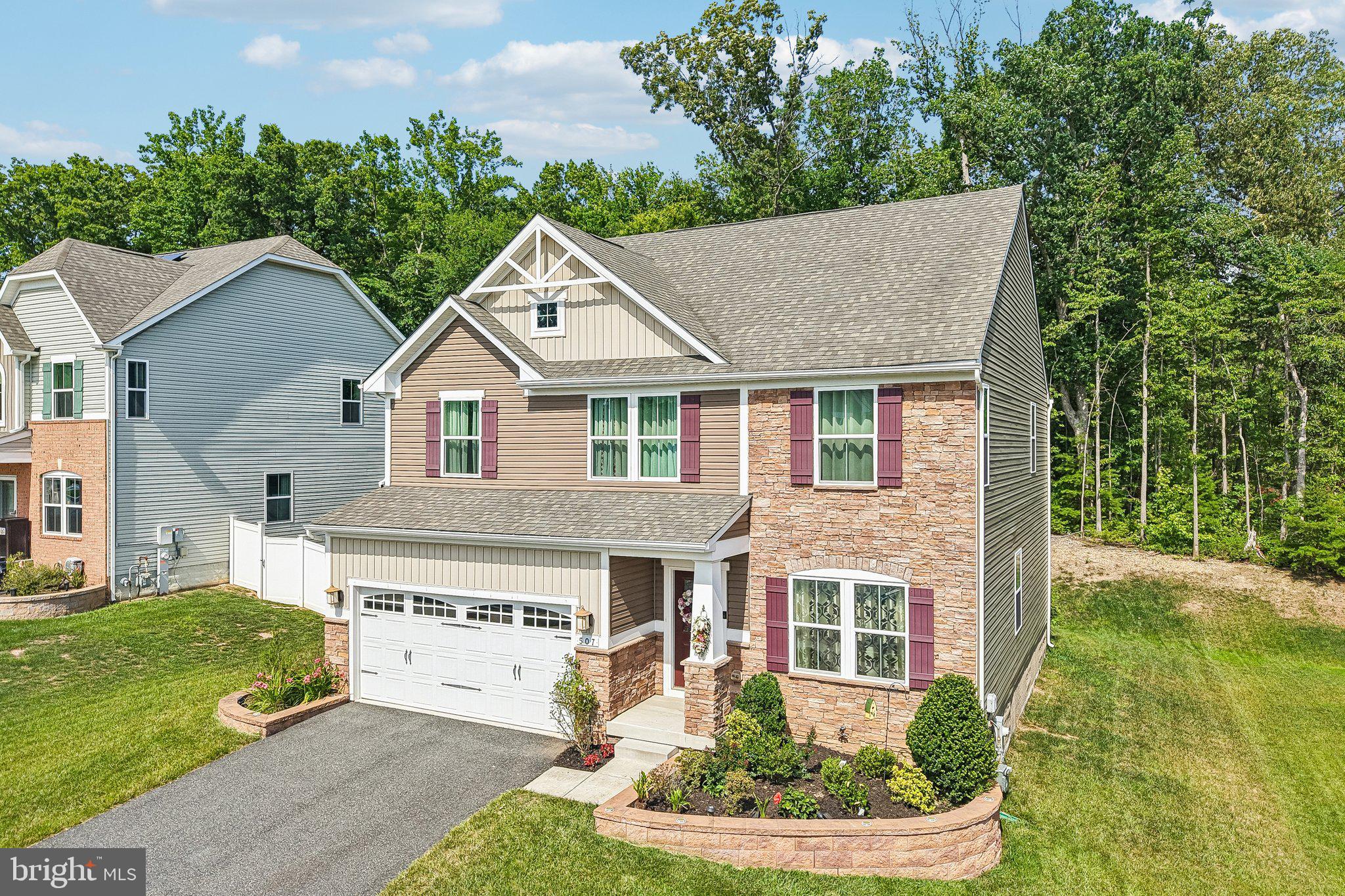 507 Potomac Road Joppa, MD 21085 - Photo 5 of 66 a aerial view of a house with a yard potted plants and a table and chair
