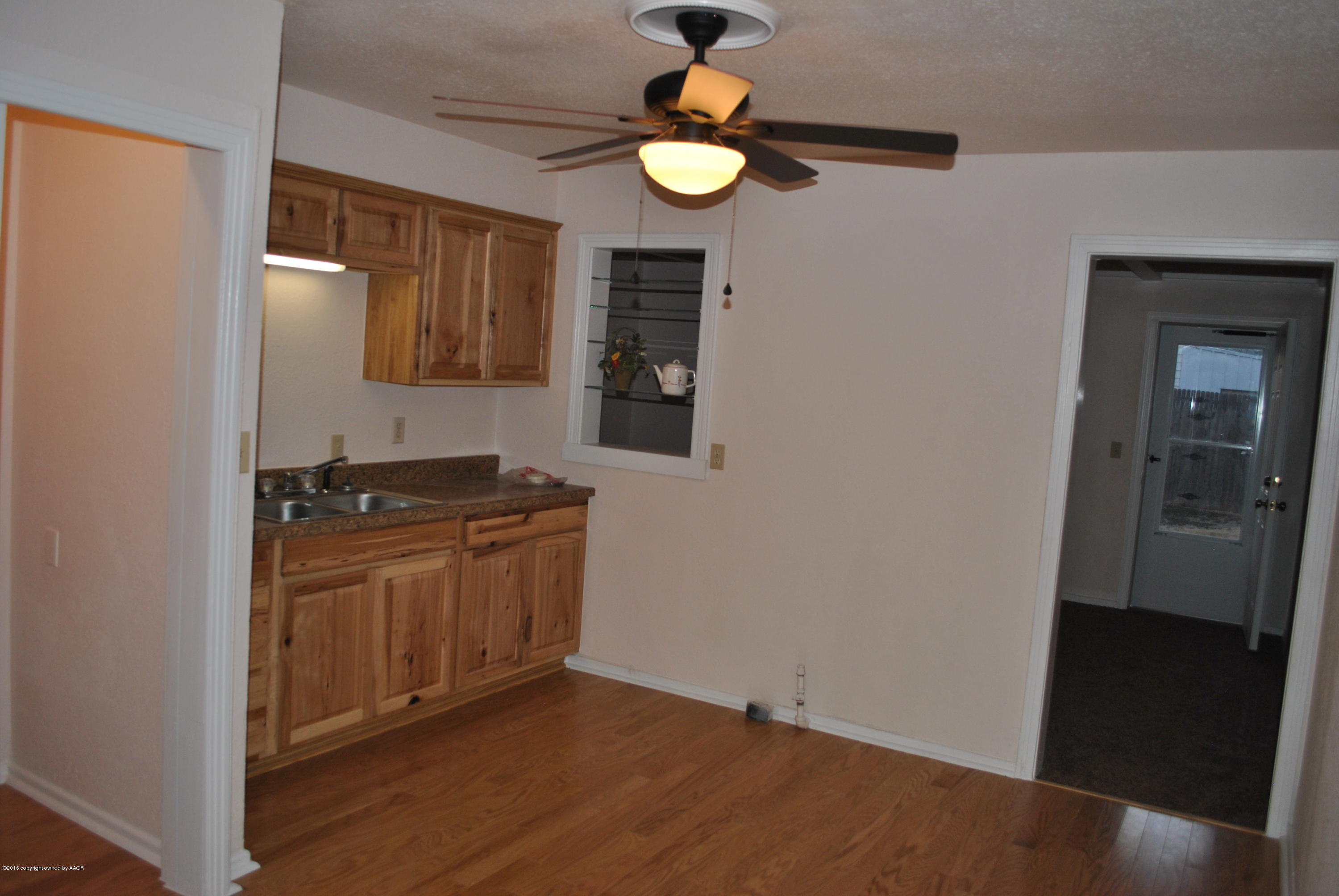 4612 South Lipscomb Street Amarillo, TX 79110 - Photo 7 of 16 a kitchen with stainless steel appliances granite countertop a stove a refrigerator and a microwave