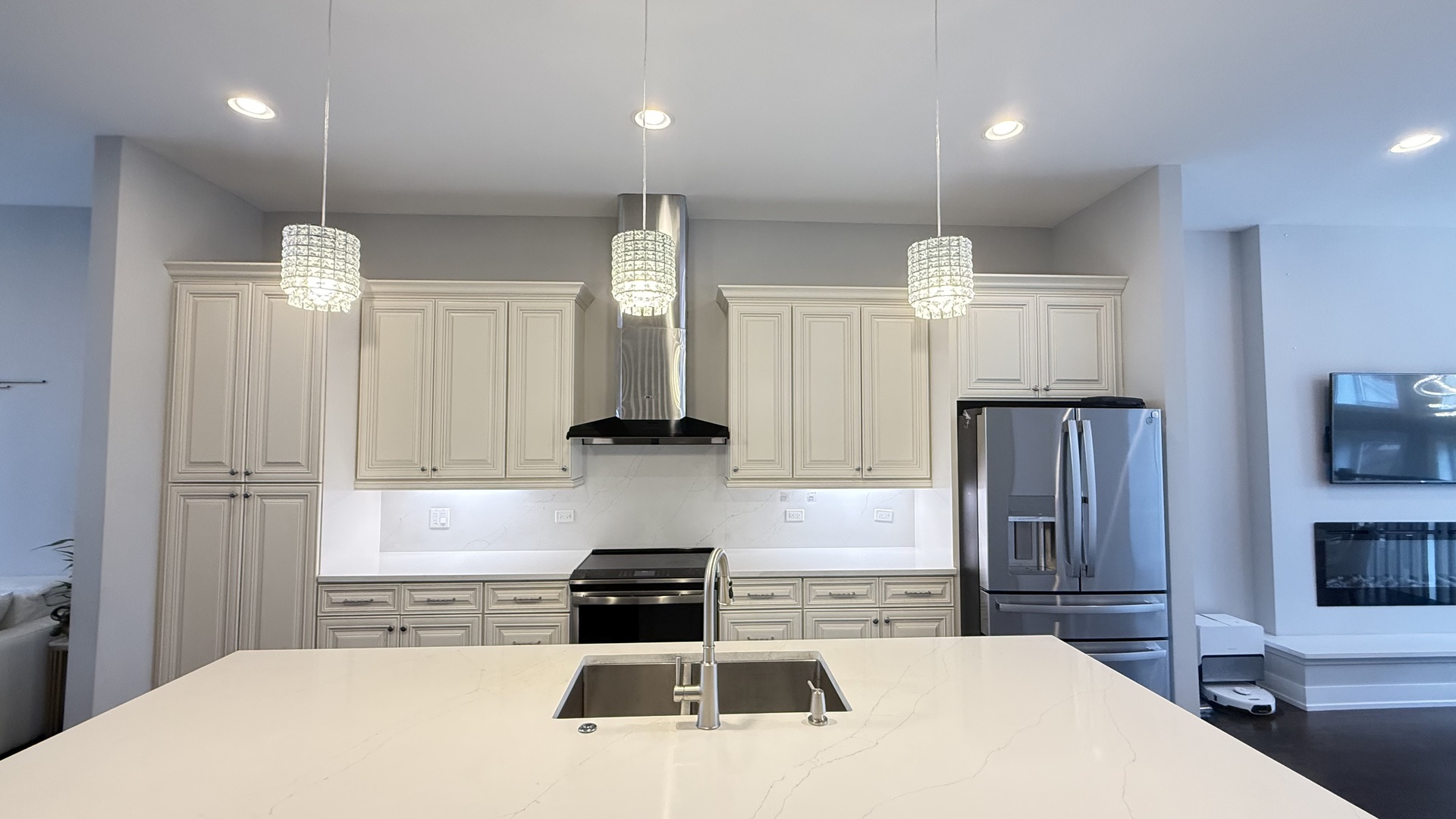 3422 South Normal Avenue Chicago, IL 60616 - Photo 12 of 48 a kitchen with granite countertop a refrigerator a stove a sink dishwasher and white cabinets with wooden floor