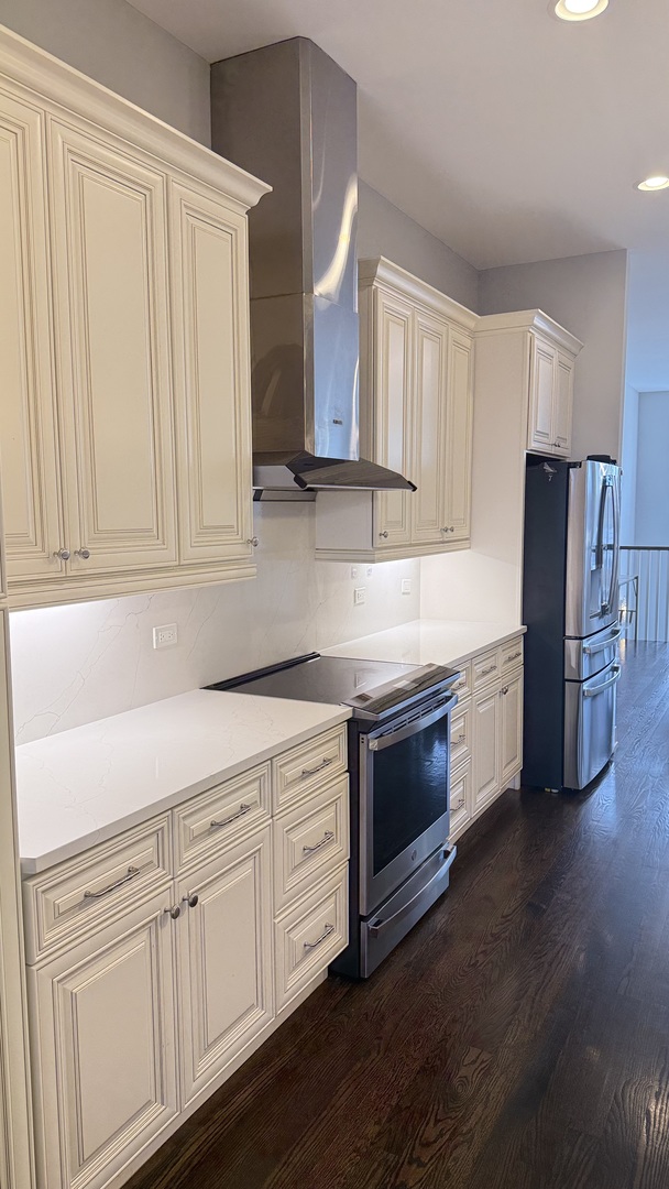 3422 South Normal Avenue Chicago, IL 60616 - Photo 15 of 48 a kitchen with granite countertop white cabinets and stainless steel appliances