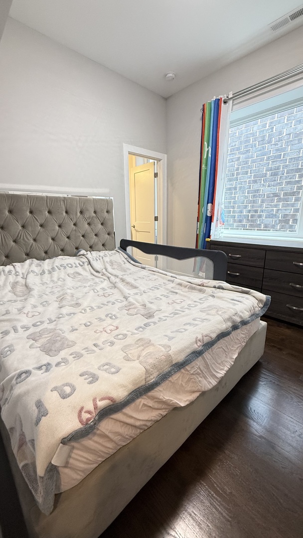 3422 South Normal Avenue Chicago, IL 60616 - Photo 24 of 48 a bedroom with a bed and window
