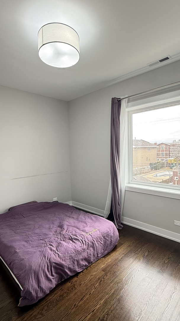 3422 South Normal Avenue Chicago, IL 60616 - Photo 29 of 48 a bedroom with a bed and a window