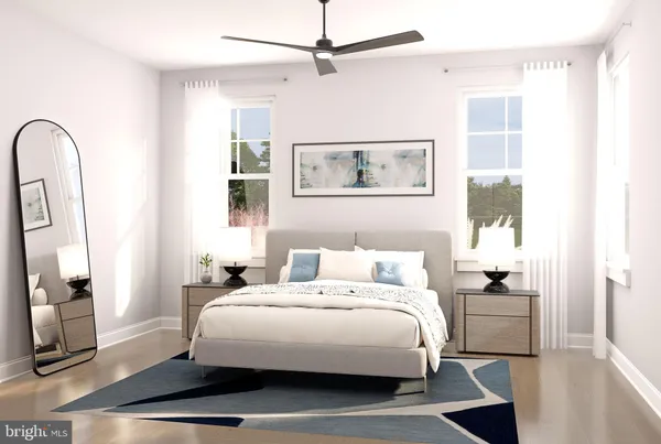 a bedroom with a bed and a mirror
