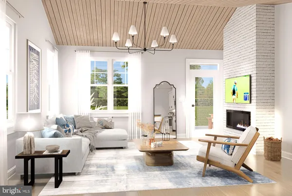 a living room with furniture a flat screen tv and a large window