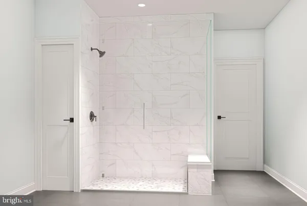 a bathroom with a glass shower door