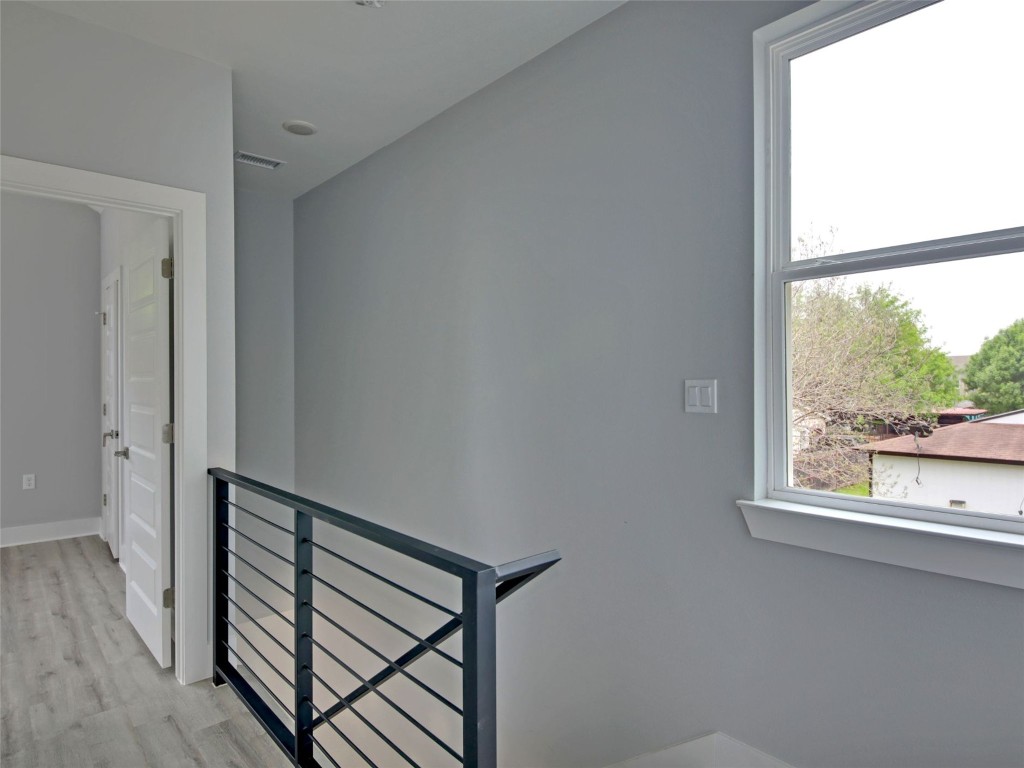 6111 Carnation Terrace, Unit 2 Austin, TX 78741 - Photo 18 of 34 Staircase featuring wood finished floors