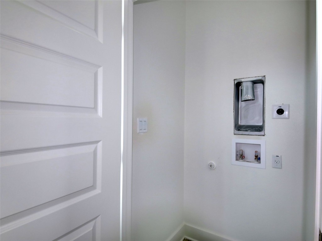 6111 Carnation Terrace, Unit 2 Austin, TX 78741 - Photo 31 of 34 Washroom featuring hookup for a washing machine, electric dryer hookup, and hookup for a gas dryer