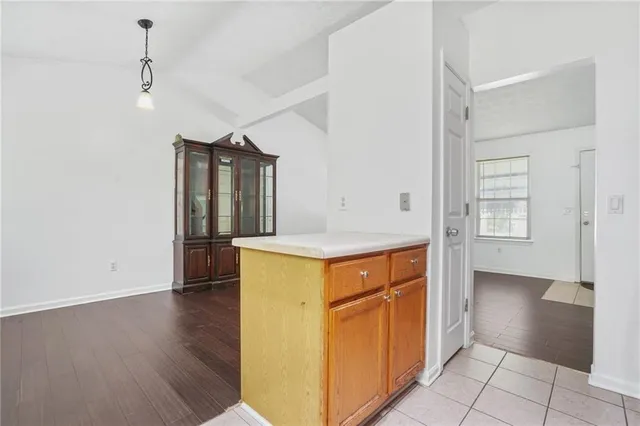 a view of walk in closet with wooden floor