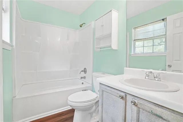 a bathroom with a sink a toilet and a bathtub