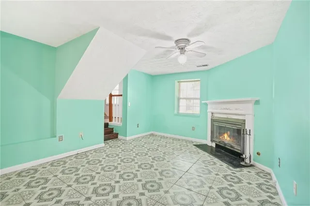 a bedroom with a bed and a fireplace