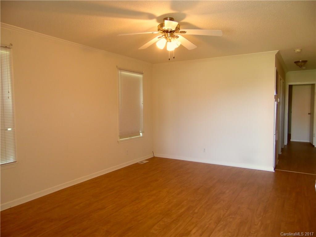 4184 State Rd S-29-304, Unit 2 Lancaster, SC 29720 - Photo 2 of 14 an empty room with a empty space and a ceiling fan