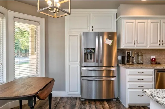a kitchen with appliances and cabinets