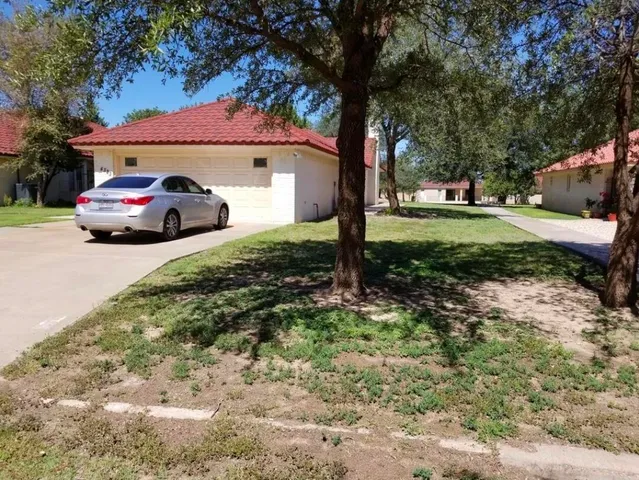 a house view with a garden space