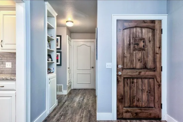 view of hallway with wooden floor