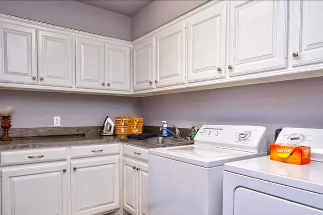 a view with cabinets and washer