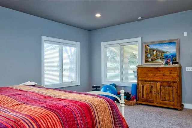 a bedroom with a bed and furniture