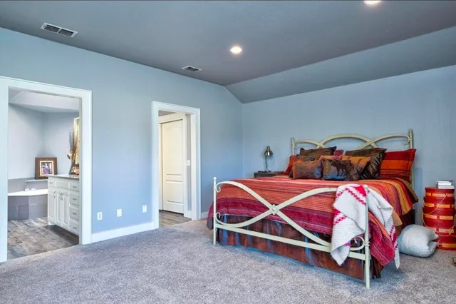 a bedroom with two beds and painted walls