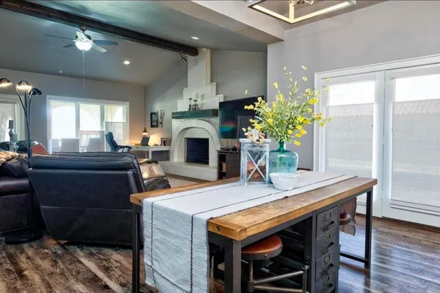 a dinning table and a fireplace in a room