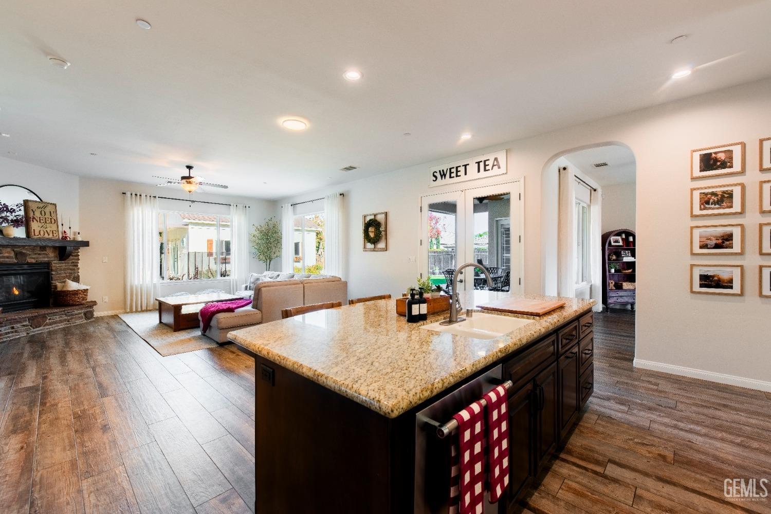 Undisclosed Address Bakersfield, CA 93312 - Photo 13 of 43 a living room with granite countertop kitchen island furniture and wooden floor