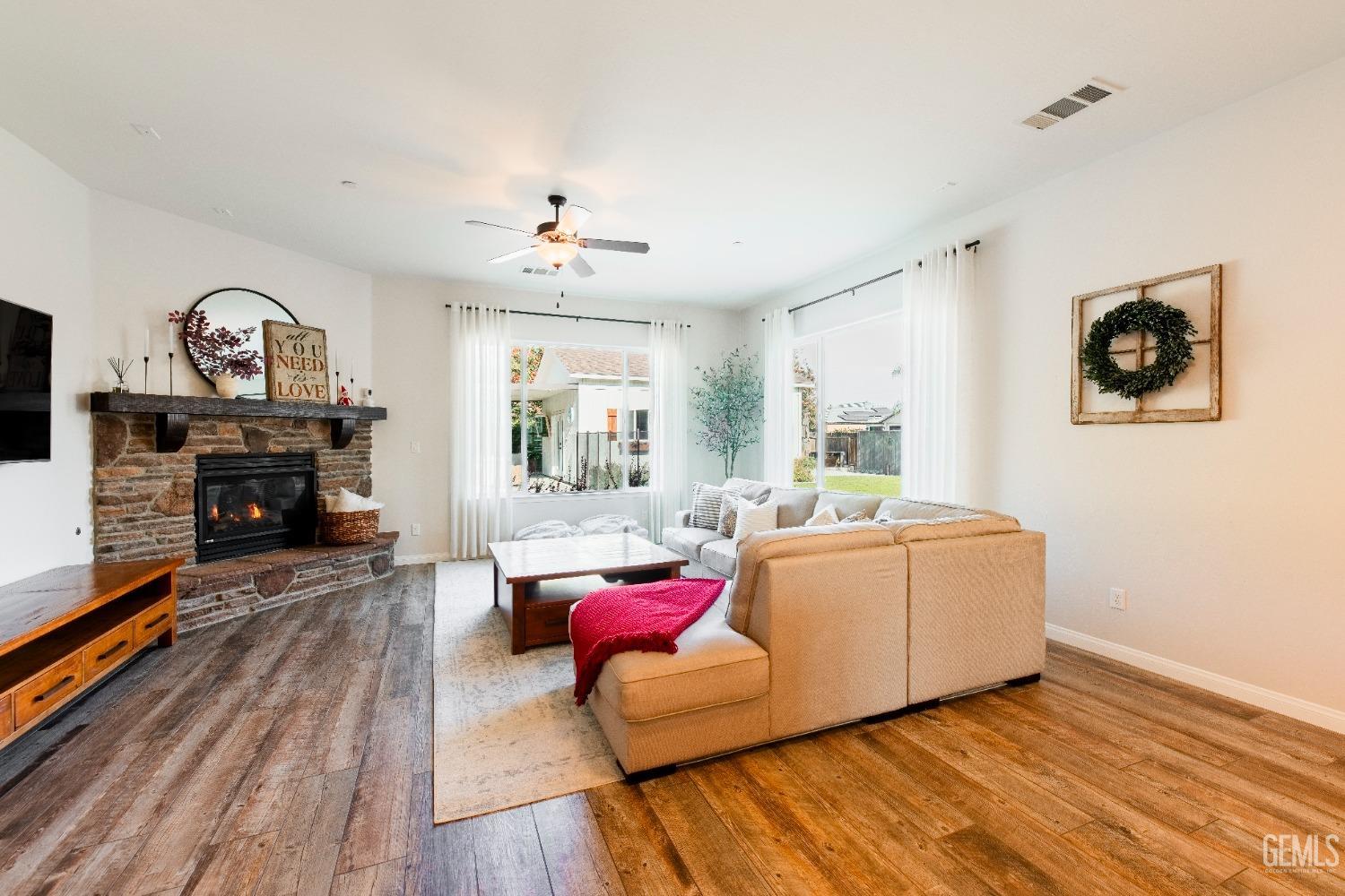 Undisclosed Address Bakersfield, CA 93312 - Photo 14 of 43 a living room with furniture and a fireplace