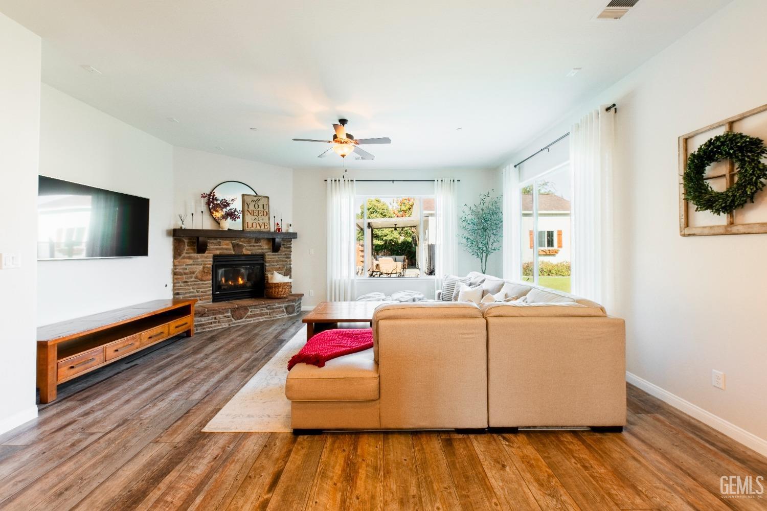 Undisclosed Address Bakersfield, CA 93312 - Photo 15 of 43 a living room with furniture and a flat screen tv