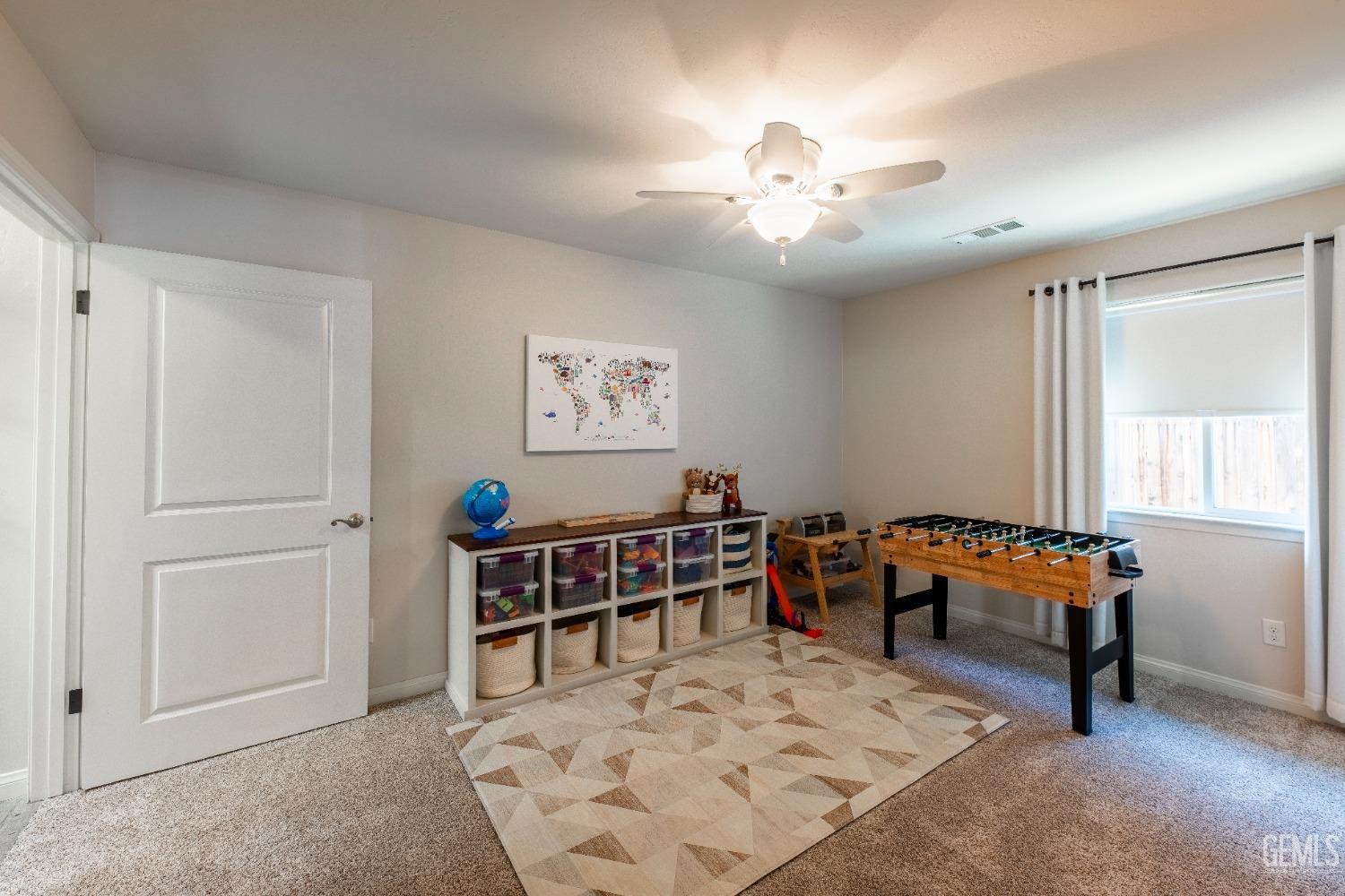 Undisclosed Address Bakersfield, CA 93312 - Photo 19 of 43 a living room with furniture and a window