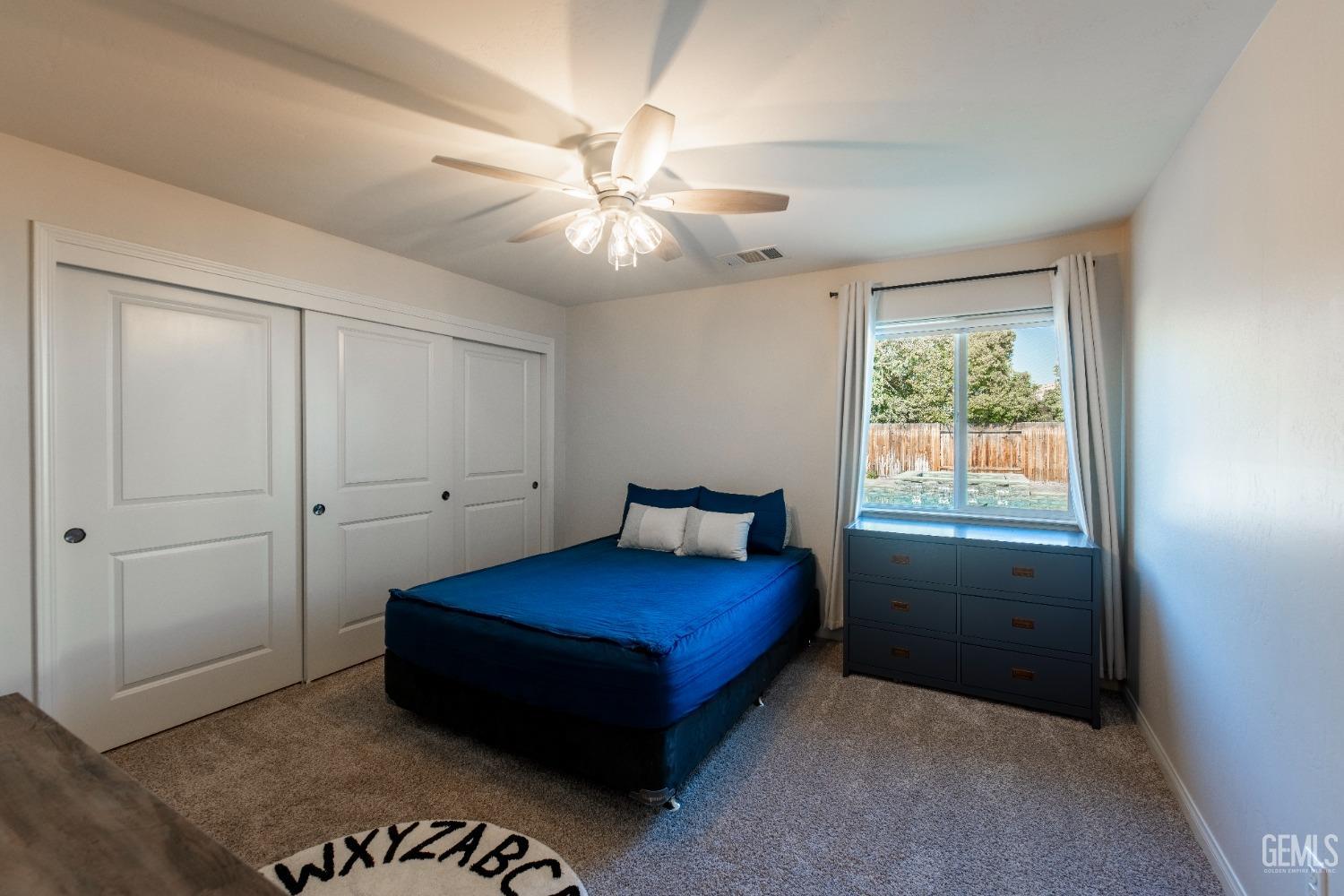 Undisclosed Address Bakersfield, CA 93312 - Photo 23 of 43 a living room with a bed and a window