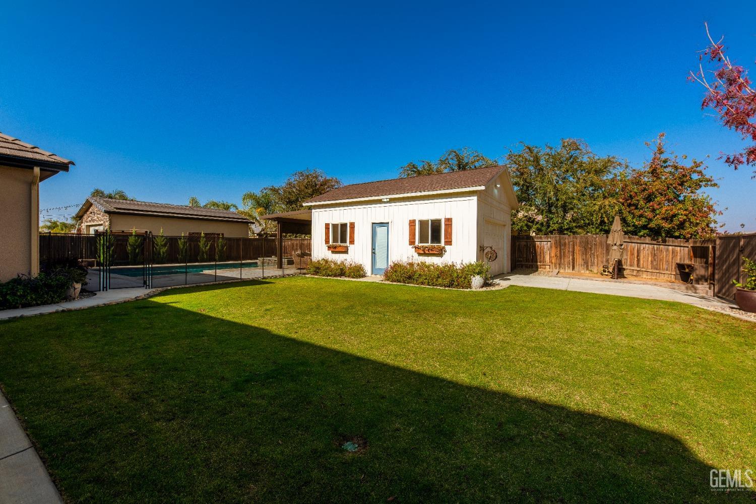Undisclosed Address Bakersfield, CA 93312 - Photo 35 of 43 a view of a house with a swimming pool