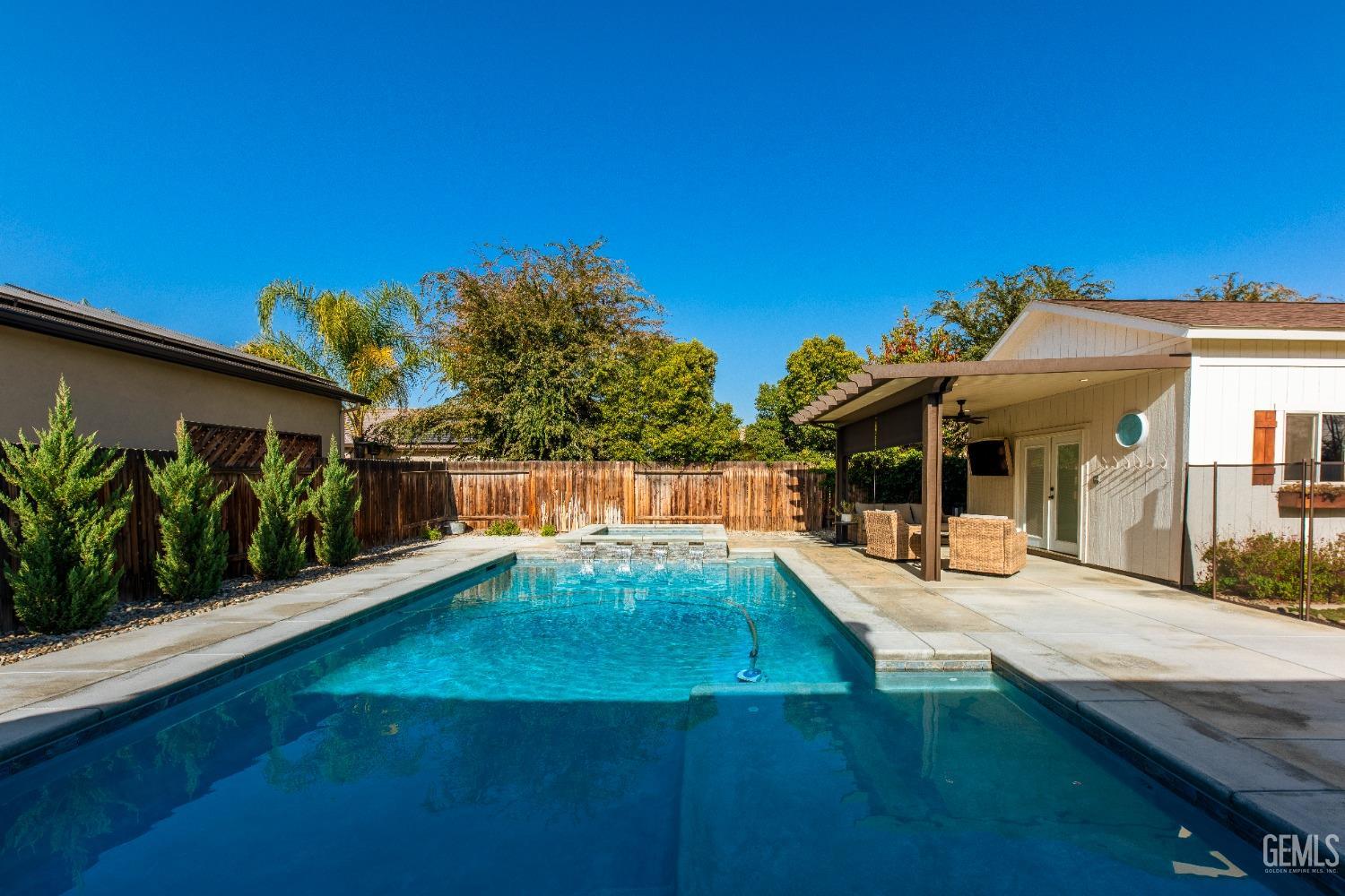 Undisclosed Address Bakersfield, CA 93312 - Photo 38 of 43 a view of a house with a swimming pool