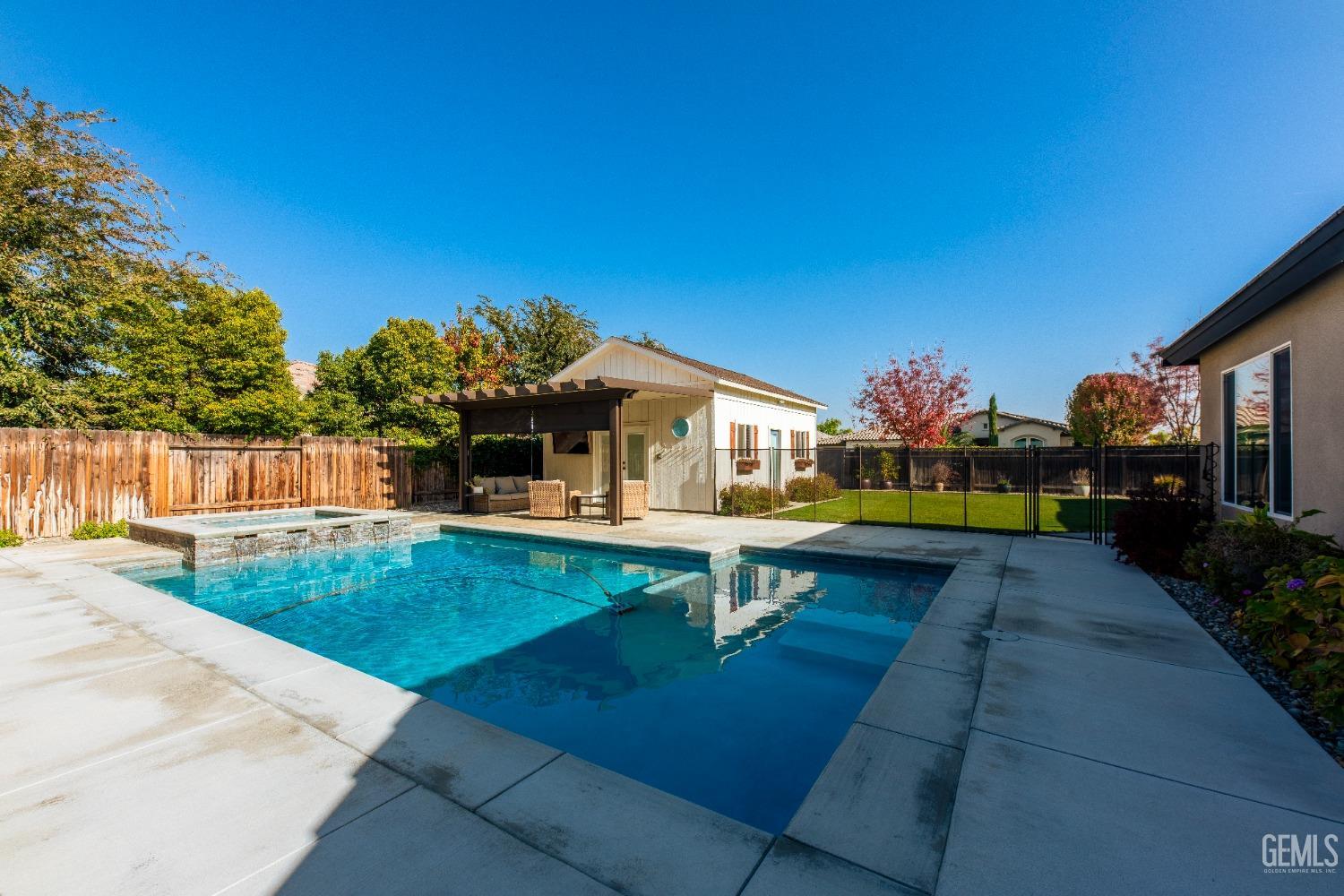 Undisclosed Address Bakersfield, CA 93312 - Photo 39 of 43 a view of a swimming pool with a patio