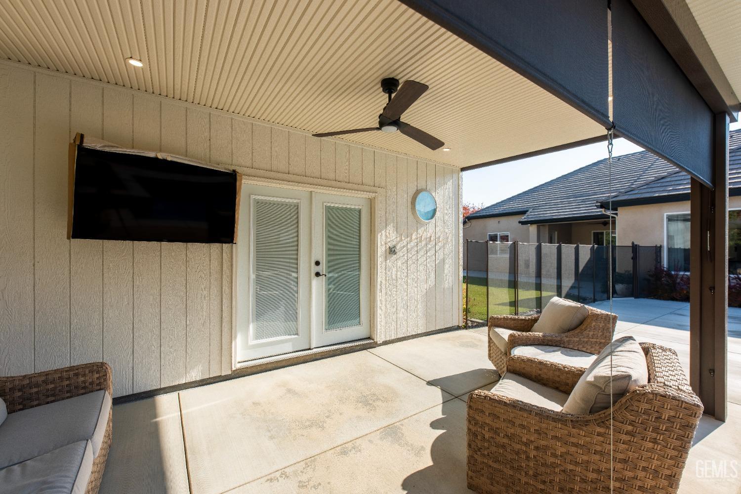 Undisclosed Address Bakersfield, CA 93312 - Photo 42 of 43 a living room with furniture and a flat screen tv