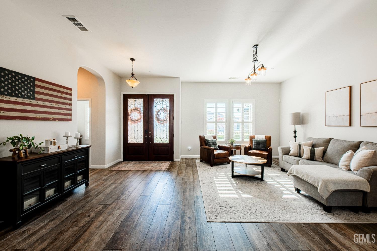 Undisclosed Address Bakersfield, CA 93312 - Photo 7 of 43 a living room with furniture and wooden floor