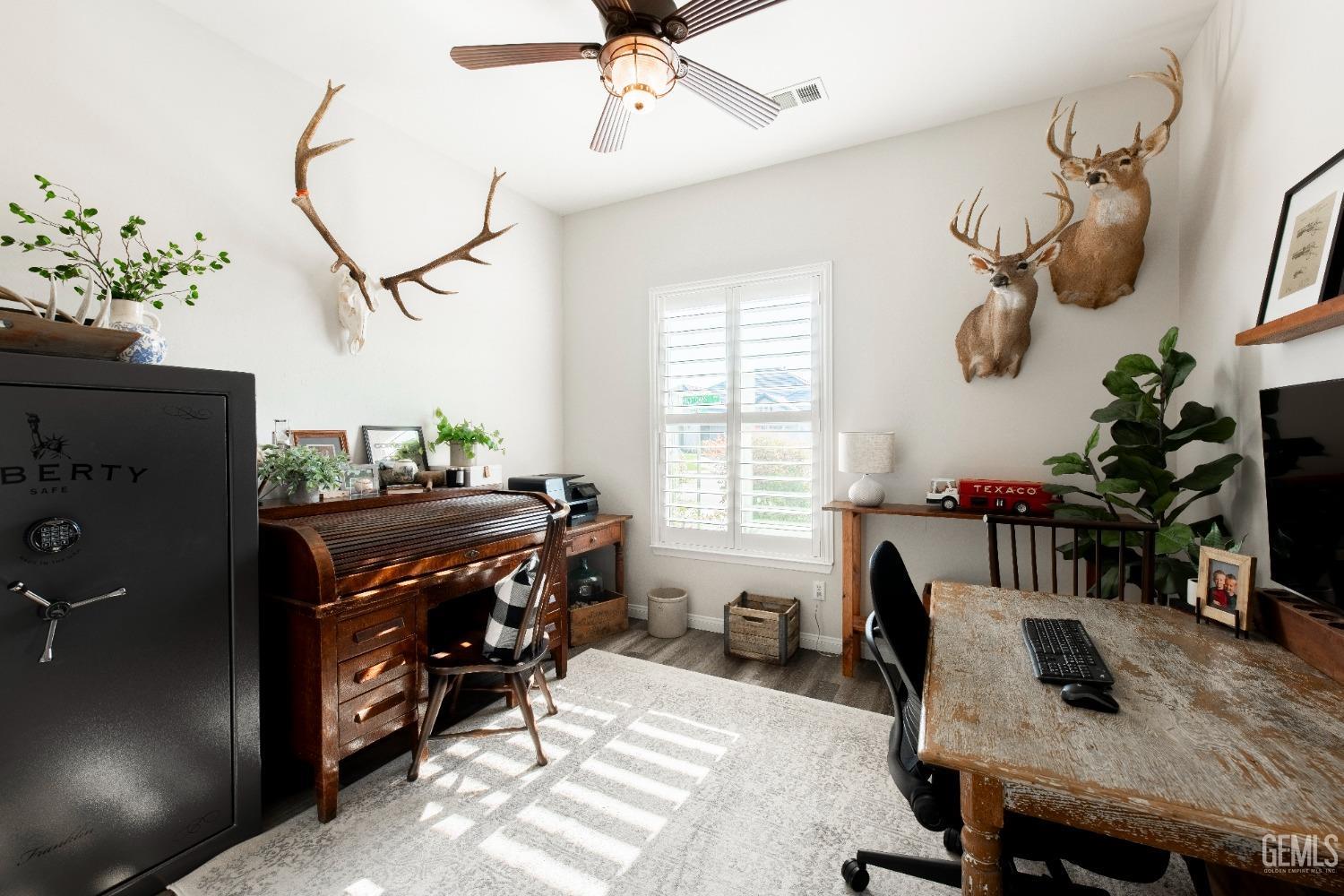 Undisclosed Address Bakersfield, CA 93312 - Photo 8 of 43 a view of a dining room with furniture window and wooden floor