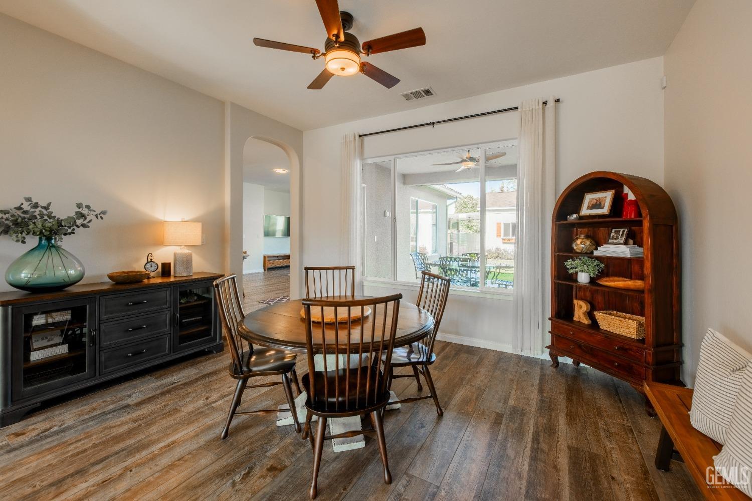 Undisclosed Address Bakersfield, CA 93312 - Photo 9 of 43 a view of a dining room with furniture and wooden floor