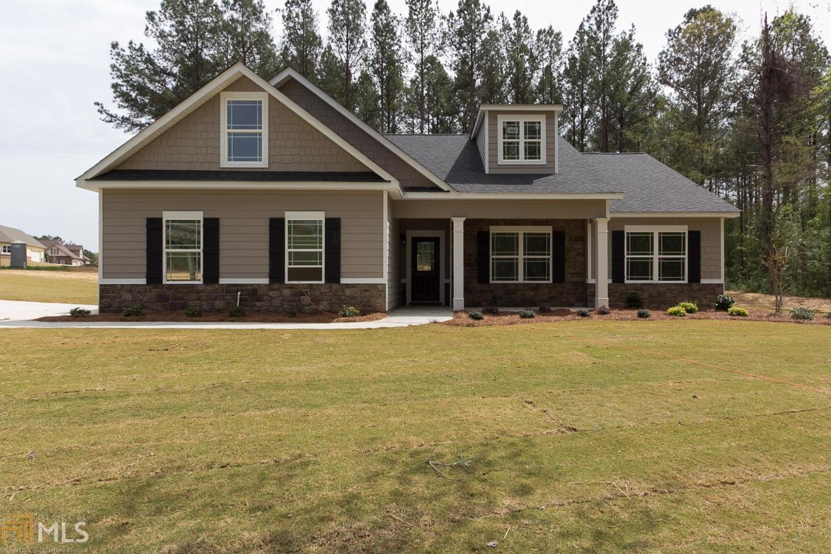 3821 Dixie Road Covington, GA 30014 - Photo 1 of 1 a front view of a house with a yard