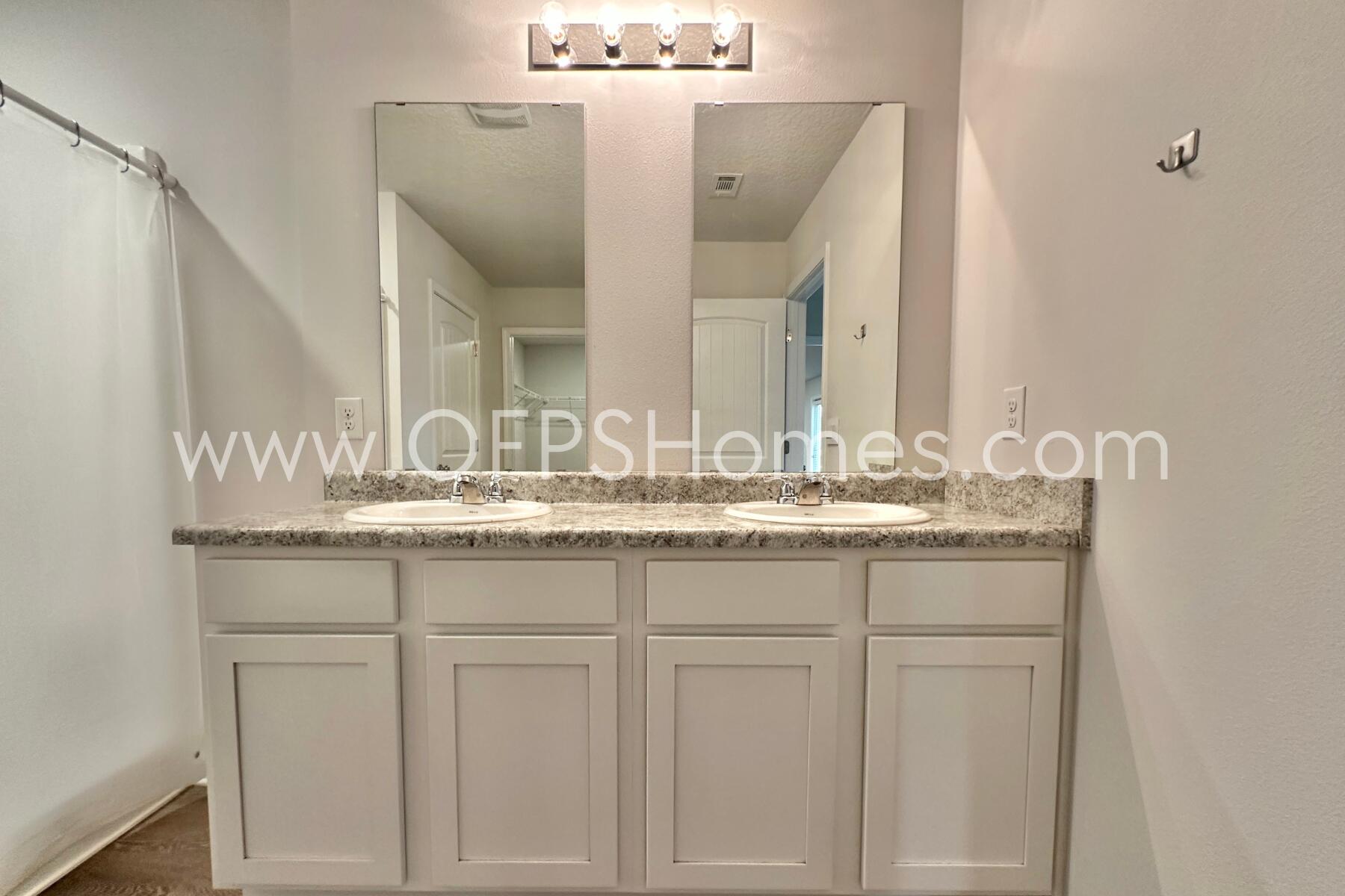 3530 Sugar Maple Lane Crestview, FL 32539 - Photo 17 of 19 a bathroom with a granite countertop sink and a mirror